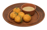 Potato croquettes with cheese and mushroom sauce